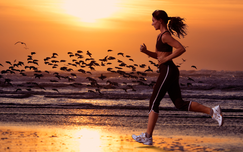 woman running on the beach How to Work Out When You Hate the Gym